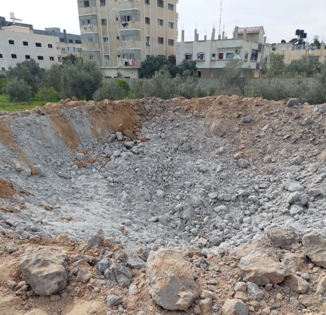 A large crater left by an Israeli air strike