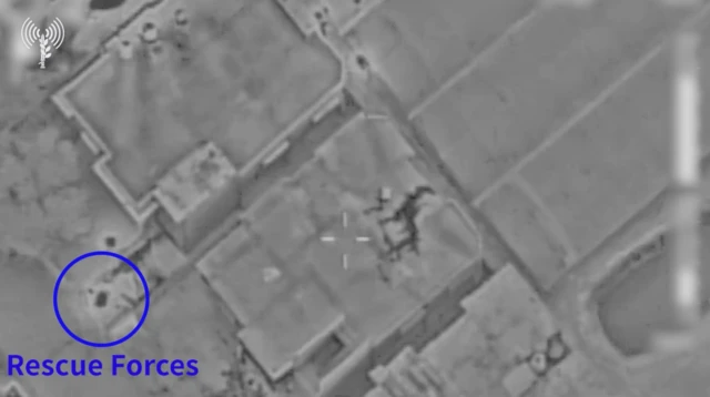 A still image from the IDF video where rescue forces are highlighted from an aerial shot