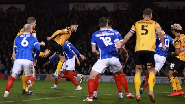 Danny Andrew heads Cambridge in front against Portsmouth