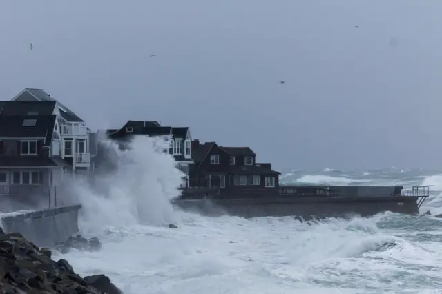 Houses, waves, sea wall