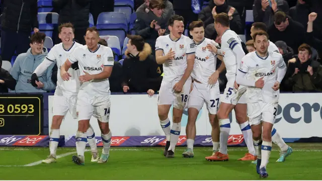 Tranmere players celebrate a goal