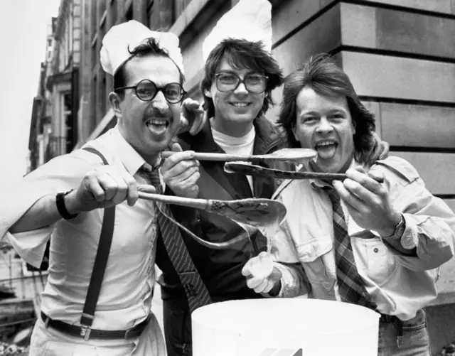 DJ's Steve Wright, Mike Read and Bruno Brooks lifting spoons of slime