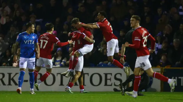 Crewe players celebrate a goal