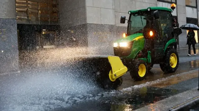 A snow plough works in New York on Tuesday morning