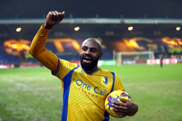 Mansfield Town's Hiram Boateng celebrates scoring a hat-trick in the 9-2 win over Harrogate