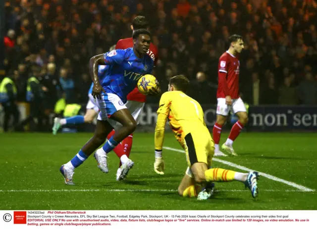 saac Olaofe of Stockport County celebrates scoring their sides first goal