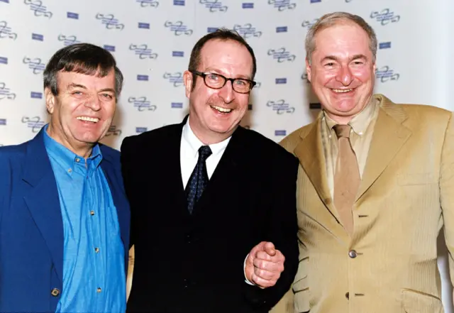 Radio DJ's Tony Blackburn Steve Wright and Paul Gambaccini standing next to each other