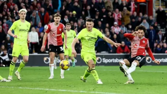 Samuel Edozie of Southampton scores his team's fifth goal during the Sky Bet Championship match between Southampton FC and Huddersfield Town at St. Mary's Stadium on February 10, 2024 in Southampton, England.