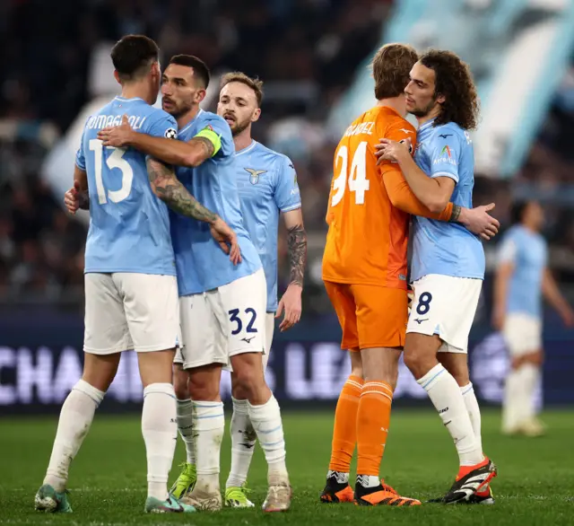 Lazio players celebrate at full time after their big win.