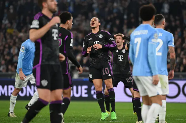 Bayern players react to a close effort from Sane.