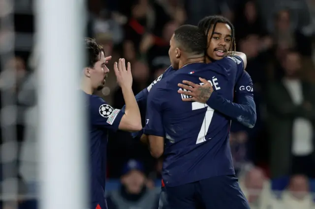 PSG players celebrate their second goal.