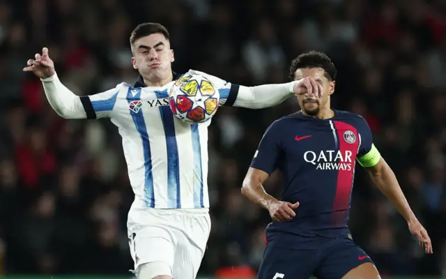 Barrenetxea controls the ball on his chest as he is marshalled by Marquinhos.