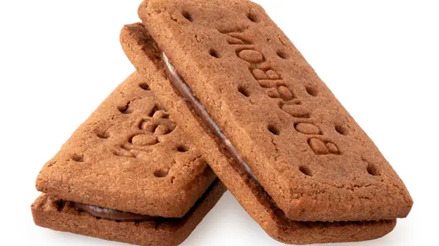 Two bourbon chocolate biscuits stacked together as inflation holds at 4% in the UK