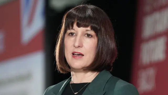 Shadow chancellor Rachel Reeves wearing a green suit