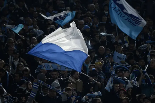 Fans wave flags in support of Lazio.