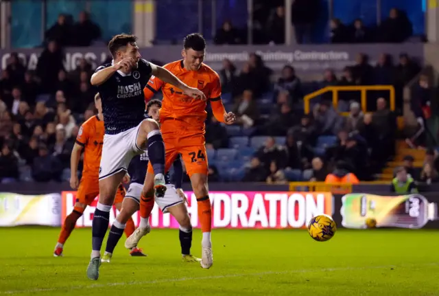 Kieffer Moore heads in Ipswich's third goal at Millwall