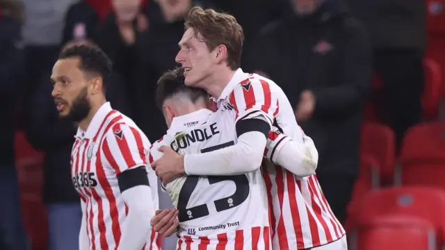 Stoke's Wouter Burger celebrates scoring against QPR with Luke Cundle