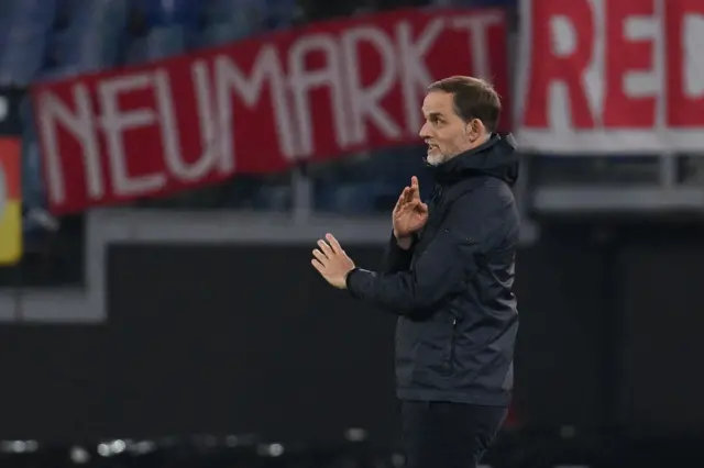 Tuchel getsures tactics at his players.