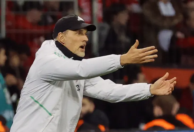 Tuchel holds his arms out in disbelief.