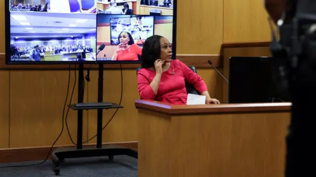 Attorney Fani Willis takes the stand as a witness during a hearing in the case of State of Georgia v. Donald John Trump at the Fulton County Courthouse in Atlanta, Georgia, U.S., February 15, 2024.