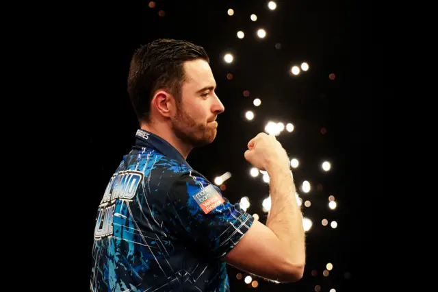 Luke Humphries celebrates beating Gerwyn Price in Glasgow