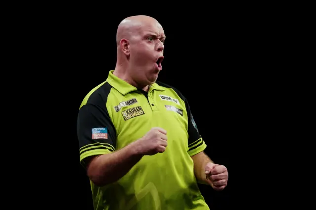 Michael van Gerwen celebrates winning a leg