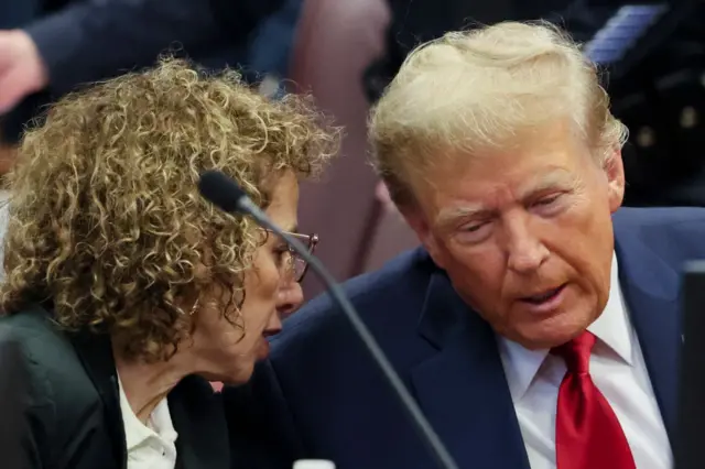 Republican presidential candidate, former US President Donald Trump talks to attorney Susan Necheles during a pre-trial hearing at Manhattan Criminal Court on February 15, 2024 in New York City.