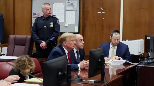 Donald Trump appears in a New York courtroom alongside his legal team