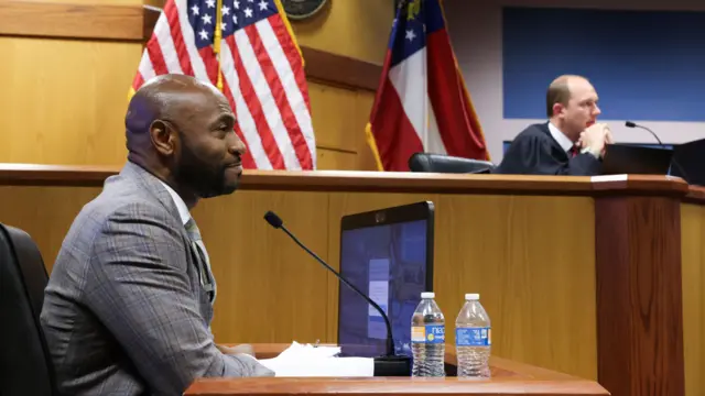 Fulton County Special Prosecutor Nathan Wade (L) looks on during a hearing in the case of State of Georgia v. Donald John Trump at the Fulton County Courthouse in Atlanta, Georgia, USA, 15 February 2024.