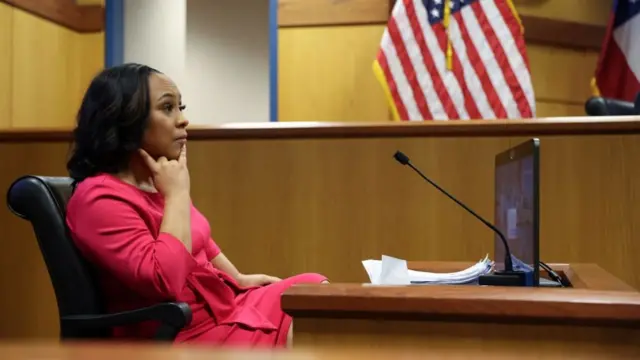 Attorney Fani Willis takes the stand as a witness during a hearing in the case of State of Georgia v. Donald John Trump at the Fulton County Courthouse in Atlanta, Georgia, U.S., February 15, 2024.