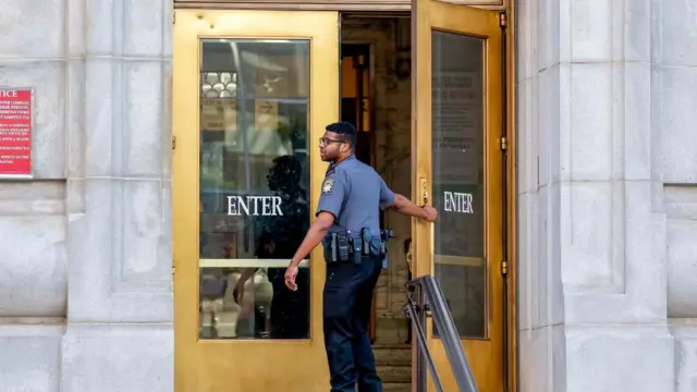 A sheriff deputy outside the Fulton County Courthouse during an evidentiary hearing for the possible disqualification of Fulton County District Attorney Fani Willis