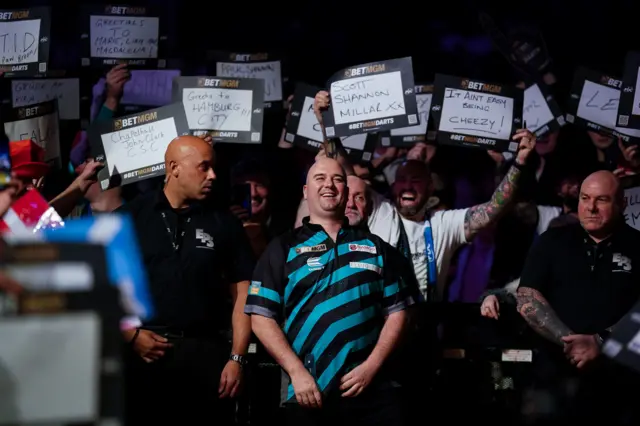 Rob Cross prepares to walk on against Michael Smith on night three of the Premier League Darts in Glasgow