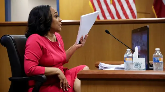 Attorney Fani Willis speaks from a witness stand during a hearing in the case of State of Georgia v. Donald John Trump at the Fulton County Courthouse in Atlanta, Georgia, U.S., February 15, 2024.