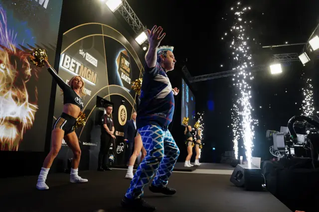 Peter Wright walks out to face Michael van Gerwen at night three in Glasgow of the Premier League Darts