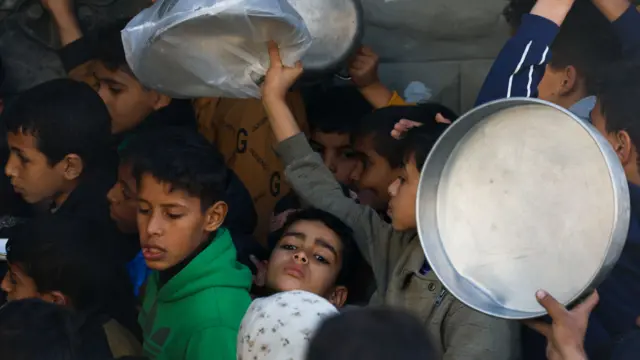 Children in a line for supplies