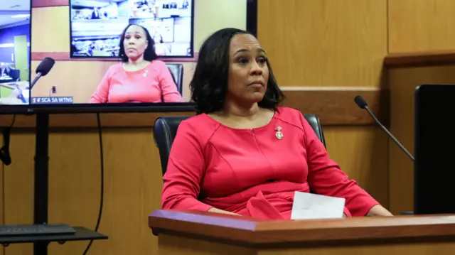 Attorney Fani Willis takes the stand as a witness during a hearing in the case of State of Georgia v. Donald John Trump at the Fulton County Courthouse in Atlanta, Georgia, USA, 15 February 2024.