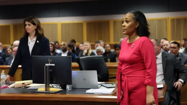 Attorney Fani Willis stands in the courtroom during a hearing in the case of State of Georgia v. Donald John Trump at the Fulton County Courthouse in Atlanta, Georgia, U.S., February 15, 2024.