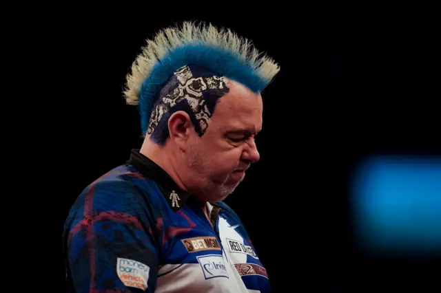 Peter Wright reacts after losing to Michael van Gerwen in the Premier League Darts in Glasgow