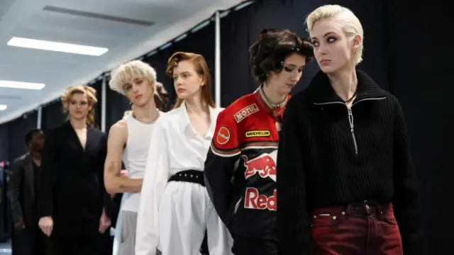 Models stand at backstage during a rehearsal on the day of the Mark Fast catwalk show during London Fashion Week