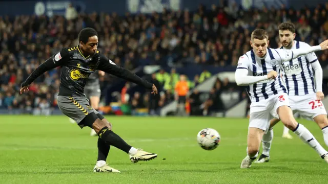 Kyle Walker-Peters shoots