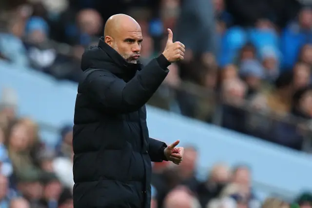 Pep Guardiola the head coach / manager of Manchester City gives a thumbs up
