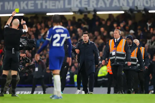 Mauricio Pochettino, manager of Chelsea, argues with referee Anthony Taylor