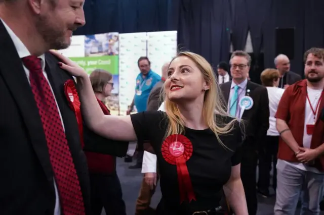 Wellingborough MP Gen Kitchen with shadow environment minister Toby Perkins, who led Labour's campaign in Wellingborough. She is seen putting her hand on his shoulder and smiling