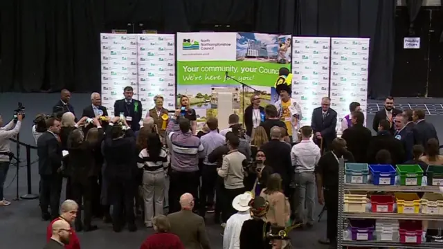 The candidates in the Wellingborough by-election are gathering on the stage