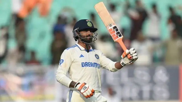 India all-rounder Ravindra Jadeja raises his bat in celebration