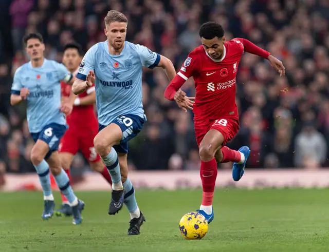 Cody Gakpo of Liverpool and Kristoffer Ajer of Brentford in action