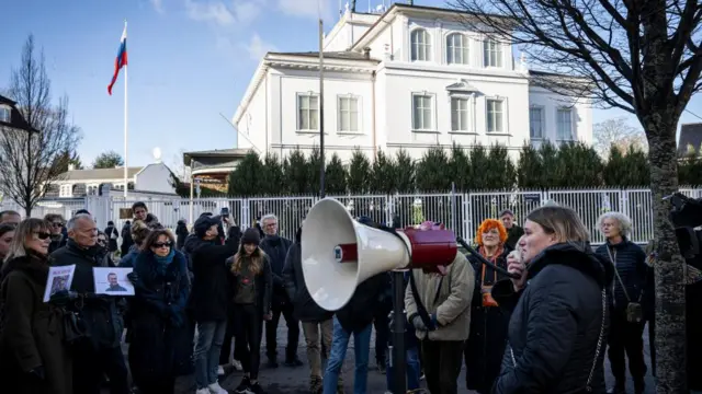 Demonstrators mourn Alexei Navalny's death outside Russian embassy in Copenhagen, Denmark - 17 Feb 2024