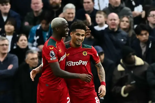 Joao Gomes (R) celebrates after scoring his team second goal