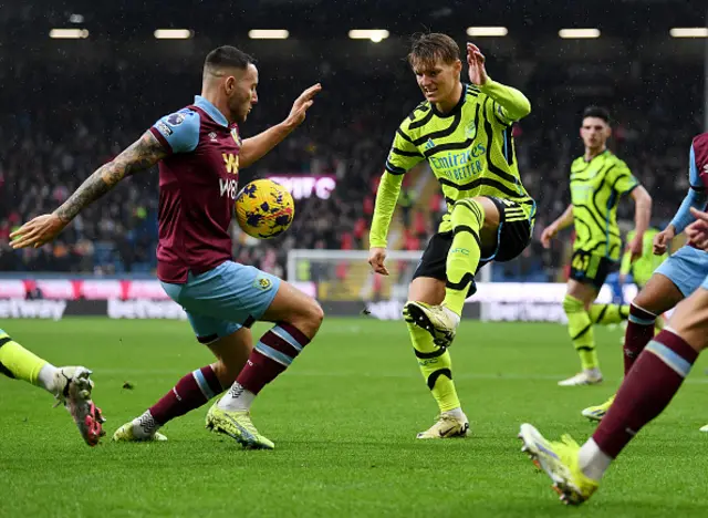 Martin Odegaard of Arsenal challenges Josh Brownhill of Burnley