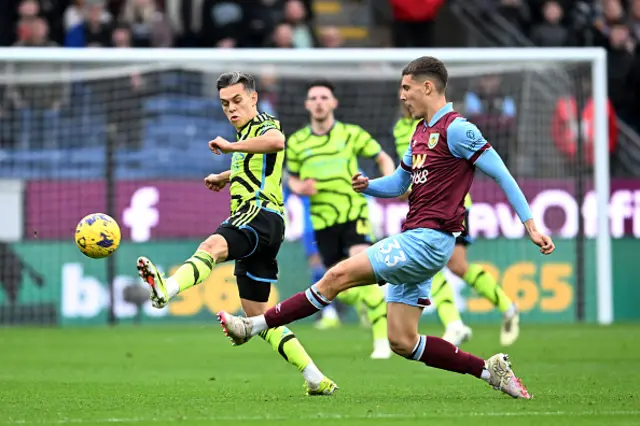 Maxime Esteve of Burnley is challenged by Leandro Trossard